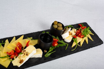 Cheese plate with olive and potatoes