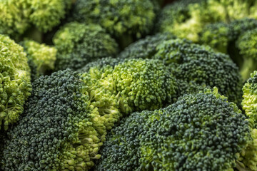  A lot of broccoli for diet and healthy eating. Fresh green broccoli on a   table.Broccoli...