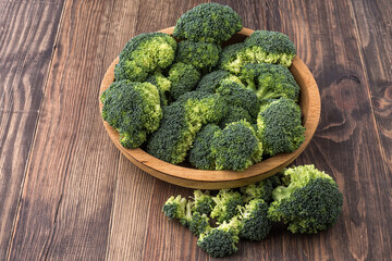  A lot of broccoli for diet and healthy eating. Fresh green broccoli on a   table.Broccoli vegetable is full of vitamin.Vegetables for diet and healthy eating.Organic food.