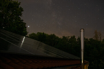 Photovoltaic system in front of night sky with stars. High quality photo
