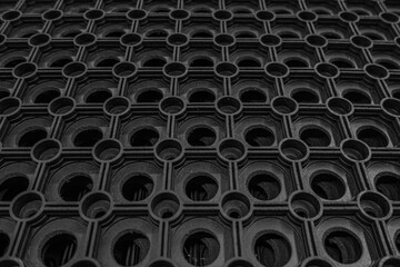 abstract background of black rubber door mat