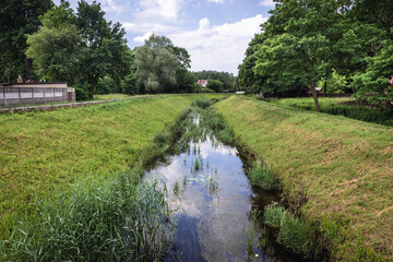 Fototapeta na wymiar Dluga River in Zielonka, small town near Warsaw, capital of Poland