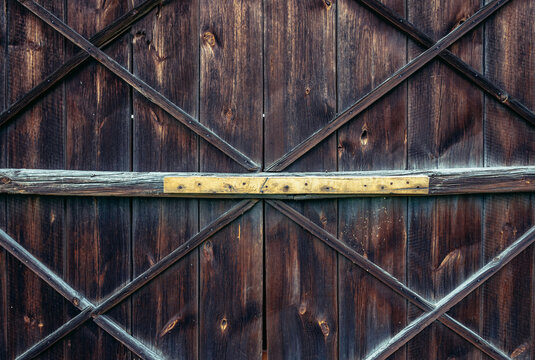 Close up on a old wooden gate of barn on a farm in Poland