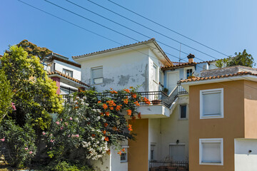 Fototapeta na wymiar Typical street and houses in city of Kavala, Greece