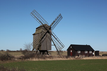 Naklejka na ściany i meble Degerhamn / Sweden - April 20 2013: Windmill at the south tip of island Oeland (Öland) in south-east of Sweden