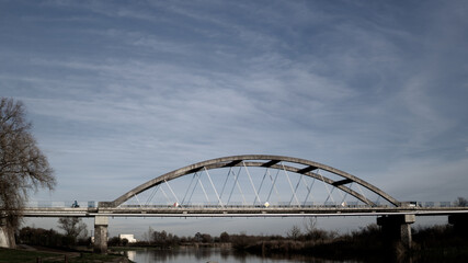 Picture of bridge in Poland with blue sky.