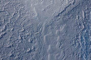 Background: Snow surface in Swiss Alps - nice waves in the frozen snow