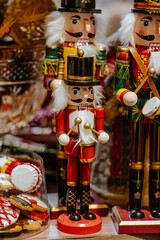 Wooden toy nutcrackers on the shop's shelf. Christmas time. Magic.