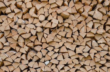 Birch firewood stacked in the woodpile
