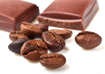 pieces of chocolate and roasted coffee beans isolated on white. close-up