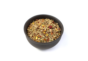 A mixture of different seasonings in a brown Cup on a white background. Side view with space for copying.