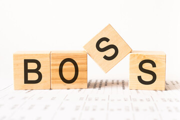 Word boss. Wooden small cubes with letters isolated on white background with copy space available.Business Concept image.