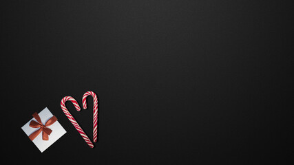Candies and gifts on black table                   