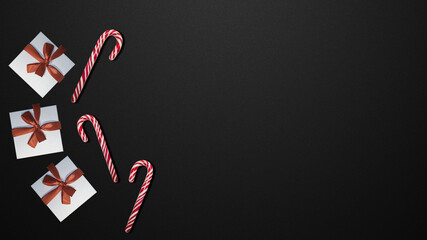 Candies and gifts on black table               