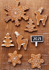 2021 sweet Christmas cookies on brown background with 2021 chalkboard for your text and logo