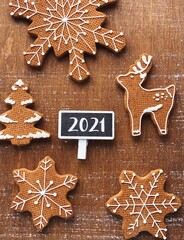 2021 sweet Christmas cookies on brown background with 2021 chalkboard for your text and logo