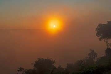 Tropical Sunset in the Haze of a Waterfall