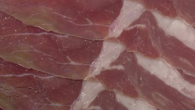 Rotation hamon close-up. Raw pork ham. Spanish national dish.