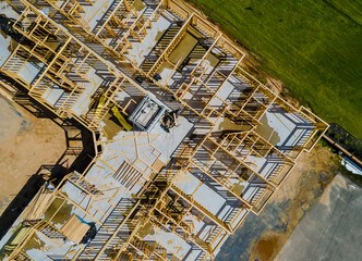 Truss, joist, beam new house under construction exterior framing timber framing