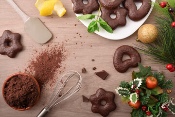 Making chocolate covered cookies on a wooden bench at Christmas