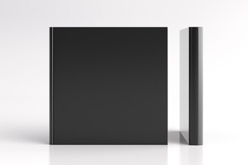 Two hardcover square black mockup books standing on the white background. Blank front cover and spine of book.