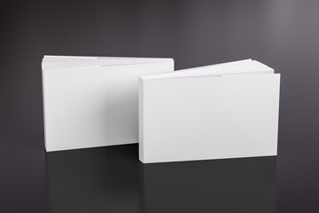 Deux livres de maquette blancs horizontaux ou paysagers à couverture souple ou brochée, debout sur le fond noir. Couverture vierge avant et arrière.