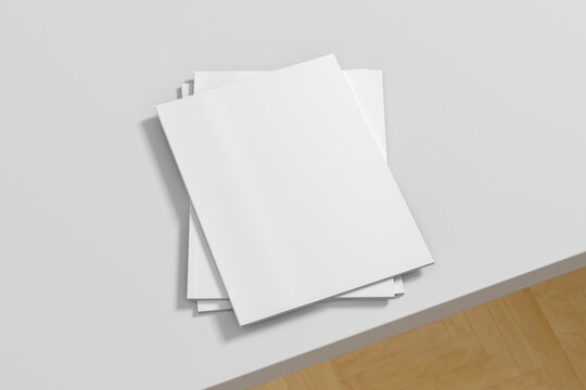 Vertical White Magazine Or Brochure Stack Mockup On White Table