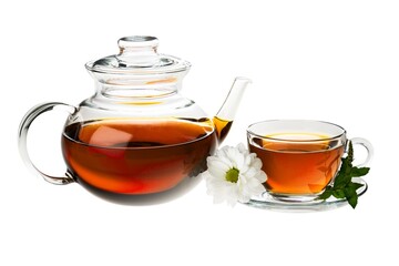 Clear teapot and teacup with mint leaves