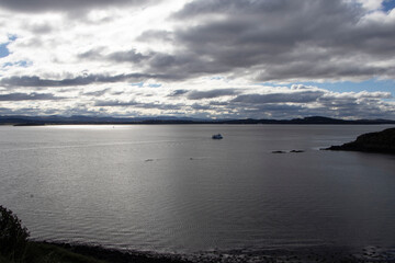 Lonely boat sailing on a sea, Firth of Forth, Edinburgh,  Scotland