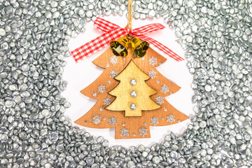 Handmade decoration Christmas plywood tree among zinc granules. Symbol of the New year. Top view. Industrial background concept for calendar.