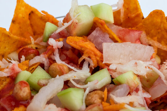 Dorilocos. They are  a mixture of doritos, jicama, carrot, japanese peanuts, cueritos and chamoy. They are very popular among children in urban areas in Mexico.