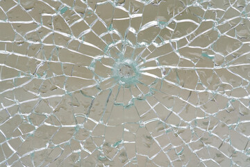 broken glass with cracks net, heavy defocused background