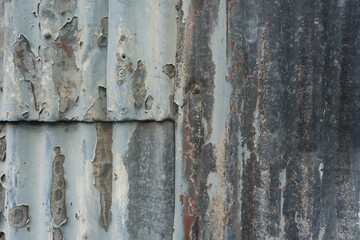 old peeling corrugated metal fence