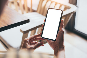 cell phone blank white screen mockup.woman hand holding texting using mobile on desk at office.background empty space for advertise.work people contact marketing business,technology