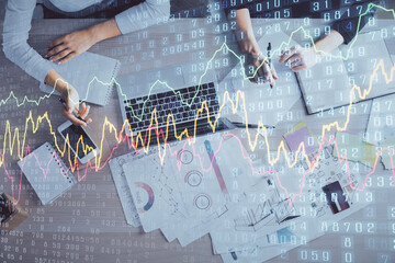Double exposure of woman hands working on computer and forex graph hologram drawing. Top View. Financial analysis concept.