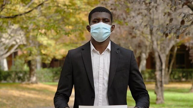 support doctors during the covid - black man shows signs in support of the NHS