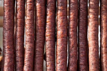 Serbian Kulen Kobasica sausage, handmade, hanging and drying in the coutryside of Serbia. Kulen is...