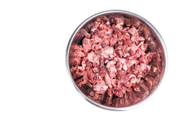 Overhead view on chunks of raw beef. Barf raw meat diet preparation for dogs