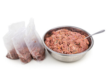 Minced barf raw food recipe for dogs consisting meat, organs, fish, eggs and vegetable are packaged for freezing - obrazy, fototapety, plakaty