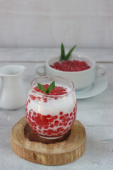 Bubur mutiara is Indonesian traditional food, made from sago pearls mixed with coconut milk or milk, with white background.