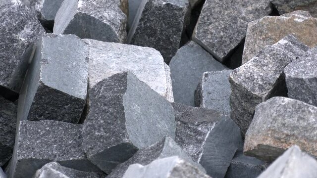 Storage blocks of granite in a quarry for sale. Rough granite blocks for construction industry. Granite block on a mine quarry  
