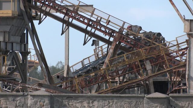 Plant for extraction and production of gravel and granite chips. Equipment for processing granite. Crusher plant with belt conveyor, crushing process, grinding stone
