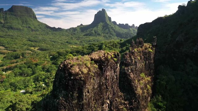 Aerial 4k view Tahiti : Tropical green jungle forest of Mount Rotui. Moorea, French Polynesia. Slow motion drone shot. Exotic travel vacation, paradise getaway, honeymoon destination.  