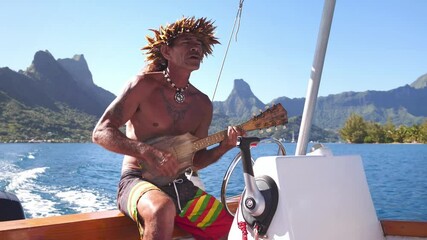 Happy traditional Tahitian man performing, playing ukulele music instrument on tourist tour in Bora Bora, Tahiti. French Polynesia. Exotic travel vacation getaway, romantic honeymoon destination.