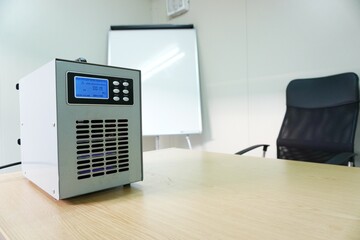 Ozone generators placed on the table in office room to cleaning and disinfection during...
