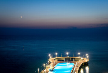 18th october, 2020. Shekvetili. Georgia. Paragrapgh five star hotel pool view with calming  sea side horizon in the background in blue hour.