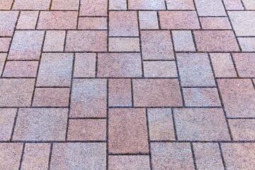 Vintage brown cobblestone pavement pattern and background