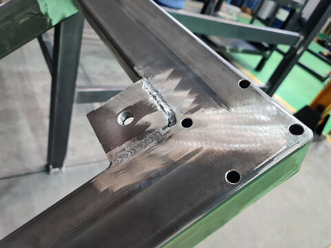Close-up Welded Threaded Lug on Metal Frame at Workshop