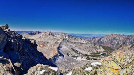 Red Pine Lake mountain landscape scenic view from White Baldy and Pfeifferhorn hiking trail, towards Little Cottonwood Canyon, Wasatch Rocky mountain Range, Utah, United States. 