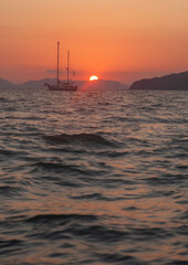 Sail boat and sunset. - 394059410